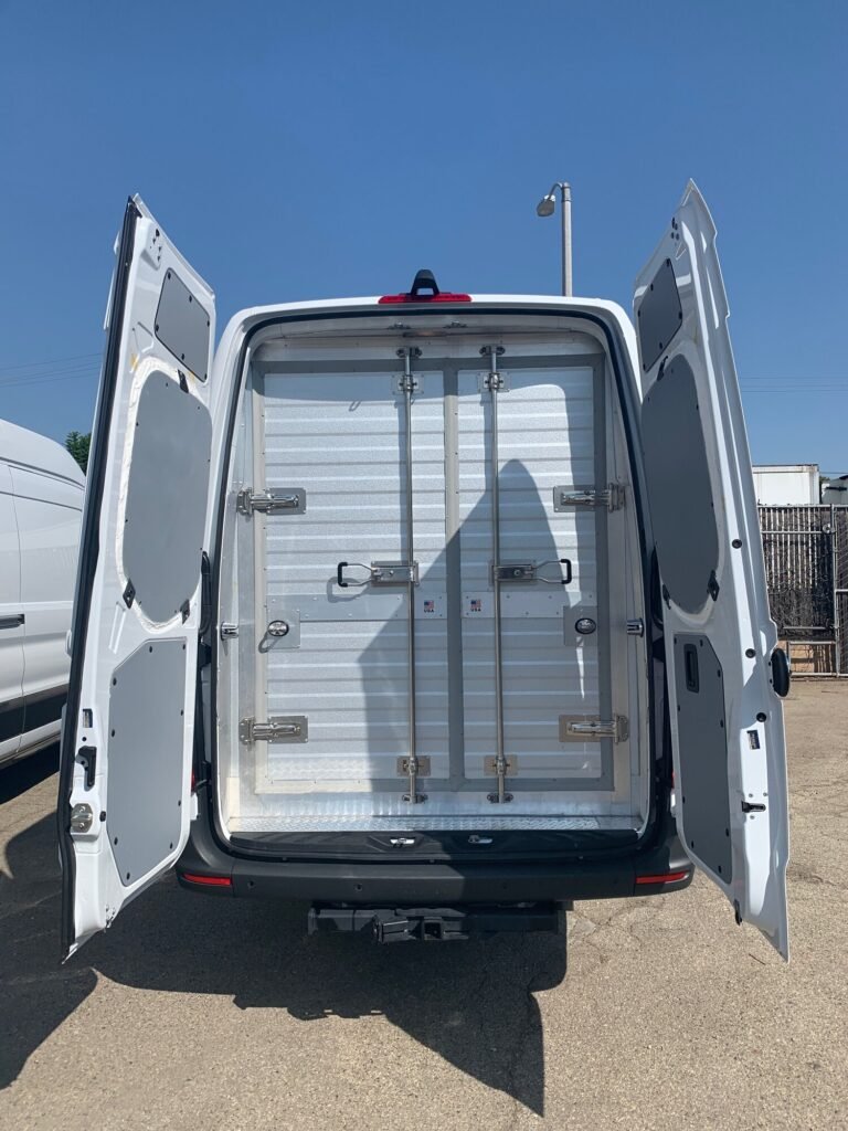 Rear view of a refrigerated rental van with both rear doors open showing the insulated cargo interior, from Refrigerated Rental Vans serving Los Angeles and Las Vegas